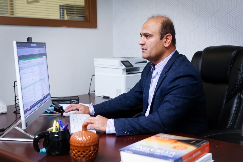 Professional working at computer desk